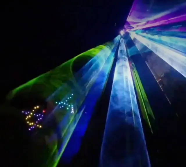 A burst of multi-coloured laser beams